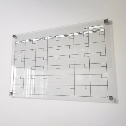 Planificador mensual de acrílico transparente con soportes de aluminio, diseño moderno y elegante. Ideal para organizar tareas, metas y actividades. Incluye marcador borrable. Envío gratis en compras en línea